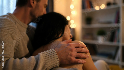 Wallpaper Mural Intimate moment between a couple sharing a tender embrace in a cozy, dimly lit room Torontodigital.ca