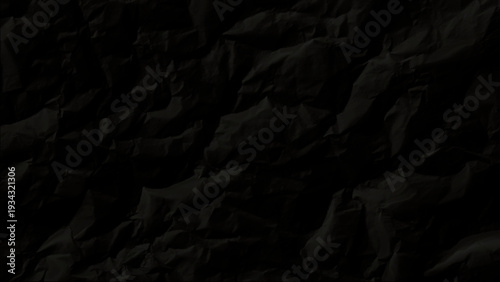 Crumpled black paper texture background for dark design elements and abstract artistic concepts