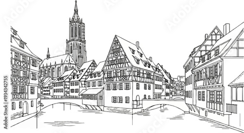 Medieval town with a spire and riverfront buildings