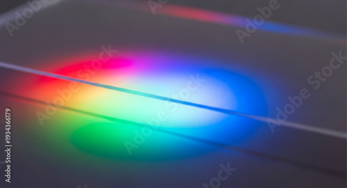 Abstract Rainbow Light Spectrum on Dark Surface.