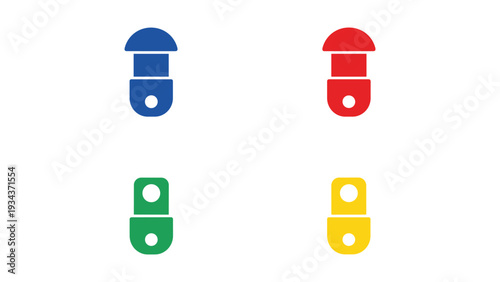 Four colorful push pins on a white surface arranged in a square formation