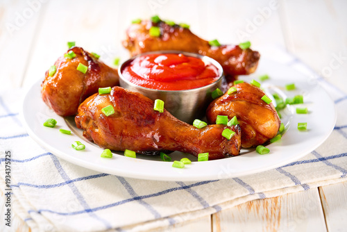 Wallpaper Mural Roast chicken drumsticks with sauce on a white table, selective focus. Torontodigital.ca
