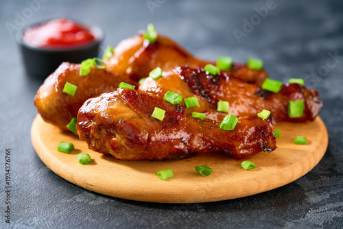 Wallpaper Mural Fried chicken legs with sauce on a black table, selective focus. Torontodigital.ca