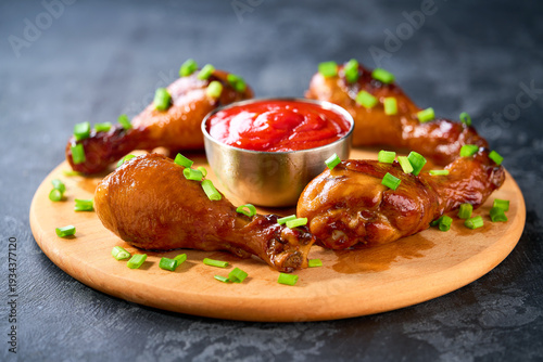 Wallpaper Mural Fried chicken legs with sauce on a black table, selective focus. Torontodigital.ca