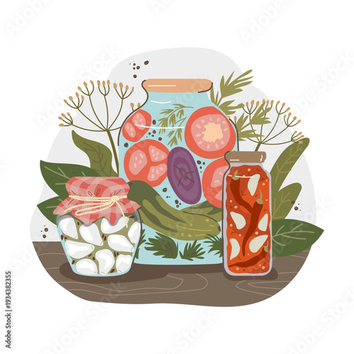 Three homemade canning jars isolated on white background. Glass jars filled with mixed vegetables, pickled cucumbers and preserved tomatoes. Farmhouse food preservation