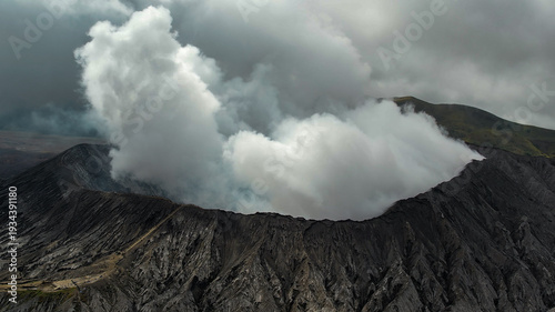 Foto Massive white plume rising from Mount Bromo crater, East Java, Indonesia