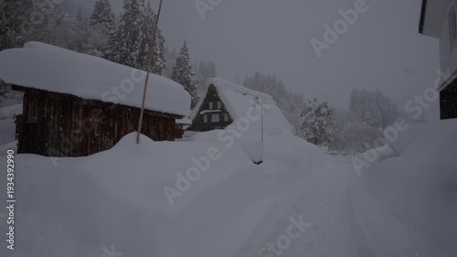 Walking in heavy snow through traditional Japanese village, Ainokura - Toyama, Japan