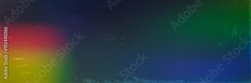 Grainy dark blue background with digital noise texture, rainbow light flare on edges and scratched weathered surface