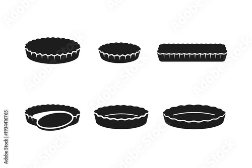 Collection of black silhouette tart pans in various shapes and sizes on a white background