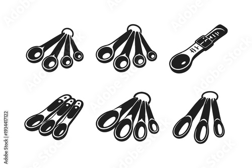 Collection of measuring spoons in various styles and sizes for culinary use