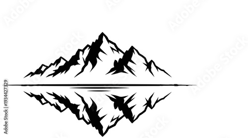 Jagged mountain peaks reflected in calm water
