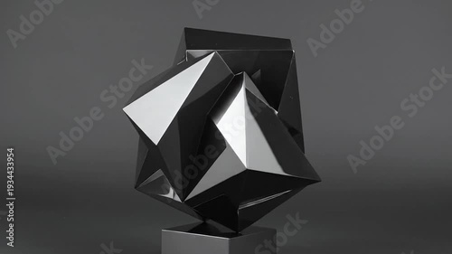 Abstract geometric sculpture with sharp angles and reflective surfaces against a dark background.