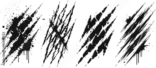 Set of black grunge claw scratch marks with splatters isolated on white background