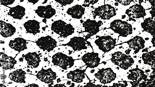 Abstract black and white grunge texture with scattered irregular spots and distressed background pattern