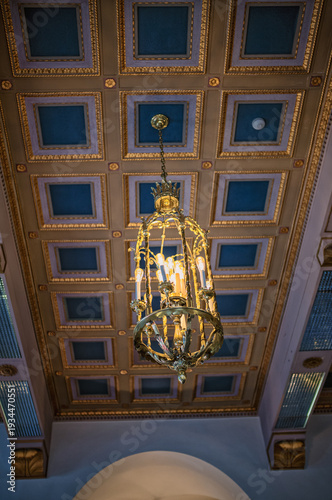 Slika na platnu Ornate Ceiling with a Golden lamp.