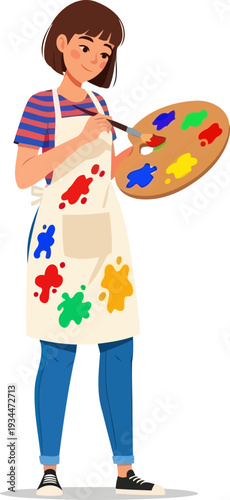 Female painter holding wooden palette and brush in art studio