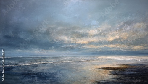 Cloudy seascape featuring reflections on still water with a hint of the sunrise on the horizon