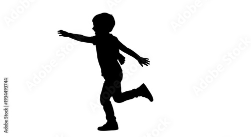 Silhouette of a Running Young Boy.
