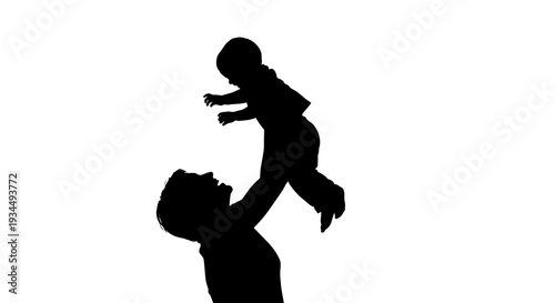 Silhouette of man holding baby.