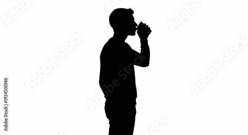 Man drinking from a bottle silhouette.