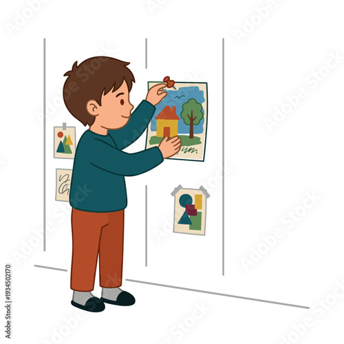 Focused caucasian boy hanging colorful drawing on classroom wall with pushpin. Concept of creativity and school pride atmosphere