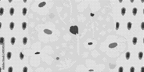 Gray fabric texture with small black spots in a random pattern on a light gray background