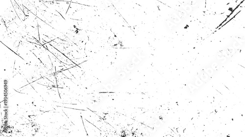 Black scratches and speckles on a white textured background abstract