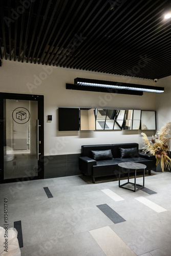 Modern interior design of a stylish lounge area with black furniture