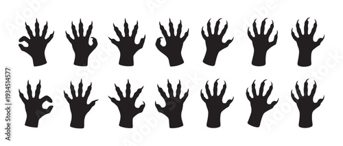 Collection of Black Silhouette Animal Paw Prints. with Sharp Claws, Isolated on White Background, Representing Wildlife.