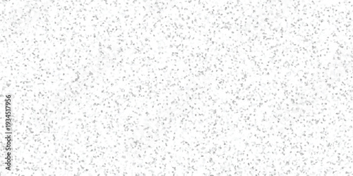 Textured abstract background featuring a dense arrangement of small, irregular grey and white mosaic tiles creating a subtle speckled effect for creative projects