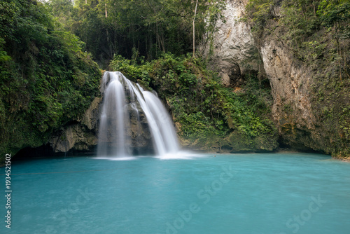 waterfall in the jungle, vivid, turquoise-blue water and lush jungle surroundings, Kawasan Falls, Badian, Cebu, the Philippines