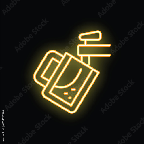 Yellow neon sign of a professional photo studio lighting equipment illuminating a dark background