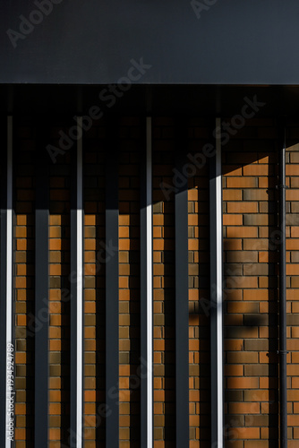 Abstract architectural wall with vertical lines and shadow patterns