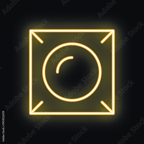 Bright yellow neon sign in the shape of a condom pack is glowing on a black background