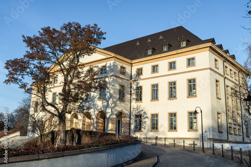 Side view of the Cultural Center at the Leuna chemical site in winter, Germany. Large GDR-era building with ballrooms, museum, and restaurant.