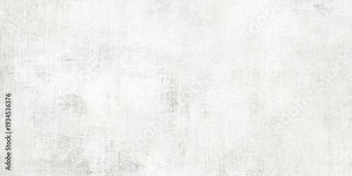 A vintage blank white paper and rough grunge wall texture with a light gray paint pattern on an old textured canvas material backdrop for an empty page surface design