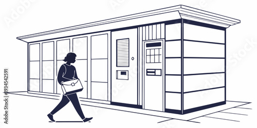 A person walking past a modern building with a glass facade and a mailbox.