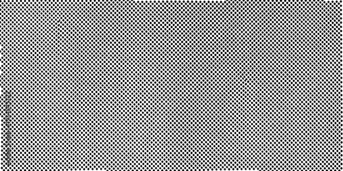 A dense repeating pattern of small dark shapes on a light background