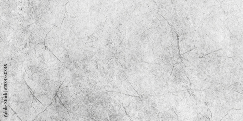 A rough white paper and cement wall texture with a grey marble stone pattern and grunge paint design on an old textured surface