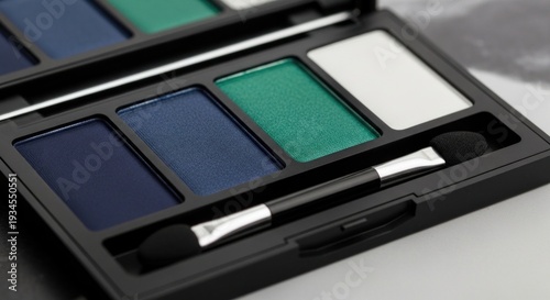 Wallpaper Mural Cosmetic eyeshadow palette displays four rich shades with applicator. Torontodigital.ca