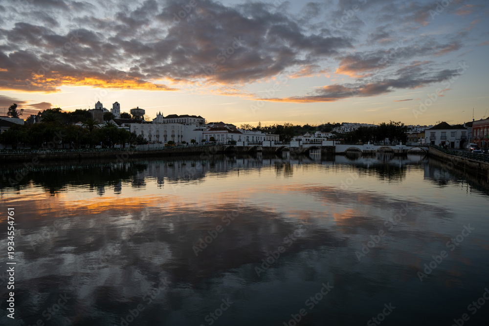 Fototapeta premium Sunset panorama of Tavira Old Bridge and riverside, Algarve, Portugal