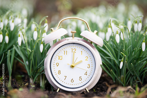 Canvas Print Switch to daylight saving time in spring, summertime changeover, alarm clock wit