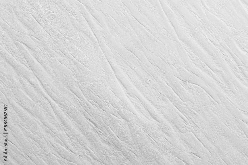 Fototapeta premium White textured surface with subtle lines and patterns created by light and shadow in a minimalist style