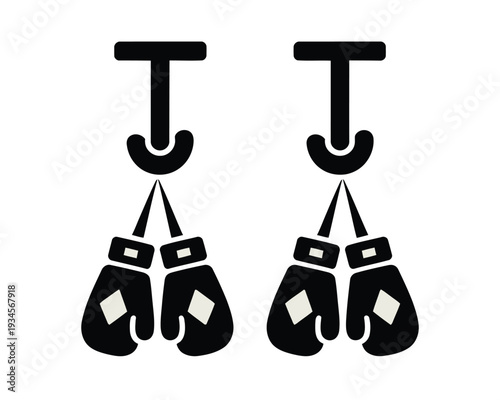 Two pairs of black boxing gloves with white diamond details hang symmetrically on hooks.
