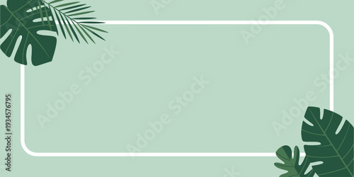 Tropical green leaves and white frame on light green background for design and decoration