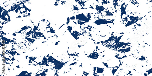 Blue grunge background with artistic ink splashes and watercolor splatters creates a dirty paint texture pattern featuring liquid spray stains on a blue paper frame design illustration