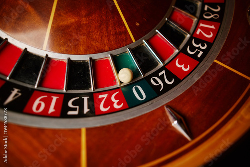 Casino theme, betting, online casino. image of red color casino roulette, poker game. roulette wheel. online casino, bets, winnings. Luxury roulette. close-up image