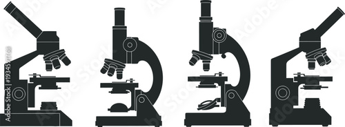 Four black microscope silhouettes on a white background
