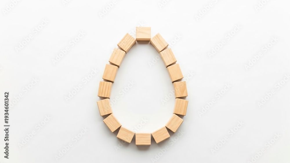 Naklejka premium Wooden Blocks Forming Oval Shape on White Background