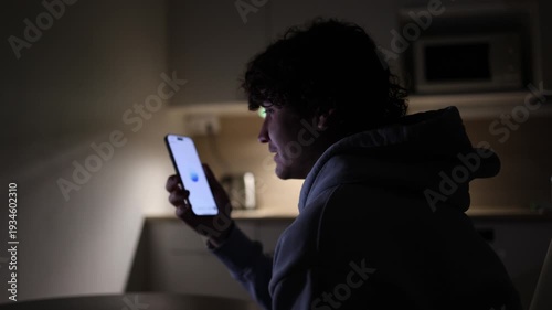 Student relaxing at home at night using smartphone talking with chatgpt asking questions about lessons and daily problems ai assistant lifestyle